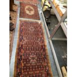 TWO ANTIQUE PERSIAN SERAB RUGS (ALTERED), LARGEST 250 x 86cms (2)