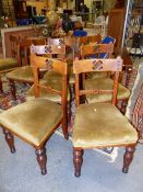 A SET OF EIGHT 19th C. OAK CHAIRS, EACH OF THE BROAD TOP RAILS PIERCED WITH A ROUNDED SQUARE OF FOUR