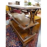 A 19th C. MAHOGANY THREE TIER BUFFET WITH BACK TO BACK C-SCROLL SUPPORTS AND PAIRS OF SCROLL FEET TO