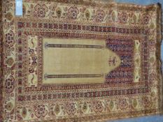 AN ANTIQUE TURKISH PRAYER RUG OF CLASSIC DESIGN 191 x 119cms