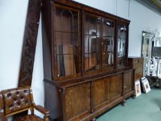 A WM IV MAHOGANY LIBRARY BOOKCASE WITH SPIRAL TWISTED COLUMNS BETWEEN THE FOUR GLAZED DOORS RECESSE