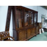 A WM IV MAHOGANY LIBRARY BOOKCASE WITH SPIRAL TWISTED COLUMNS BETWEEN THE FOUR GLAZED DOORS RECESSE