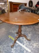 A GEORGE III MAHOGANY BIRDCAGE TRIPOD TABLE, THE CIRCULAR TOP ON A BALUSTER COLUMN AND LEGS WITH LON