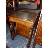 A VICTORIAN WALNUT DAVENPORT DESK.