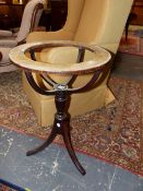 A GEORGE III MAHOGANY TRIPOD GLOBE STAND, THE RIM PRINTED AND PAINTED WITH THE MONTHS AND STAR SIGNS