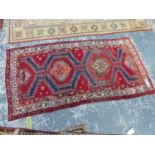 A PERSIAN TRIBAL RUG, 225 x 116cms