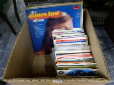 A SMALL COLLECTION OF RECORD ALBUMS AND SINGLES TO INCLUDE ROD STEWART, JAMES LAST, HOT CHOCOLATE,