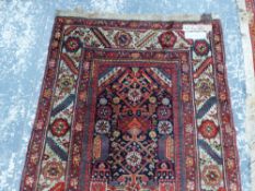 AN ANTIQUE PERSIAN TRIBAL RUNNER, 467 x 112cms