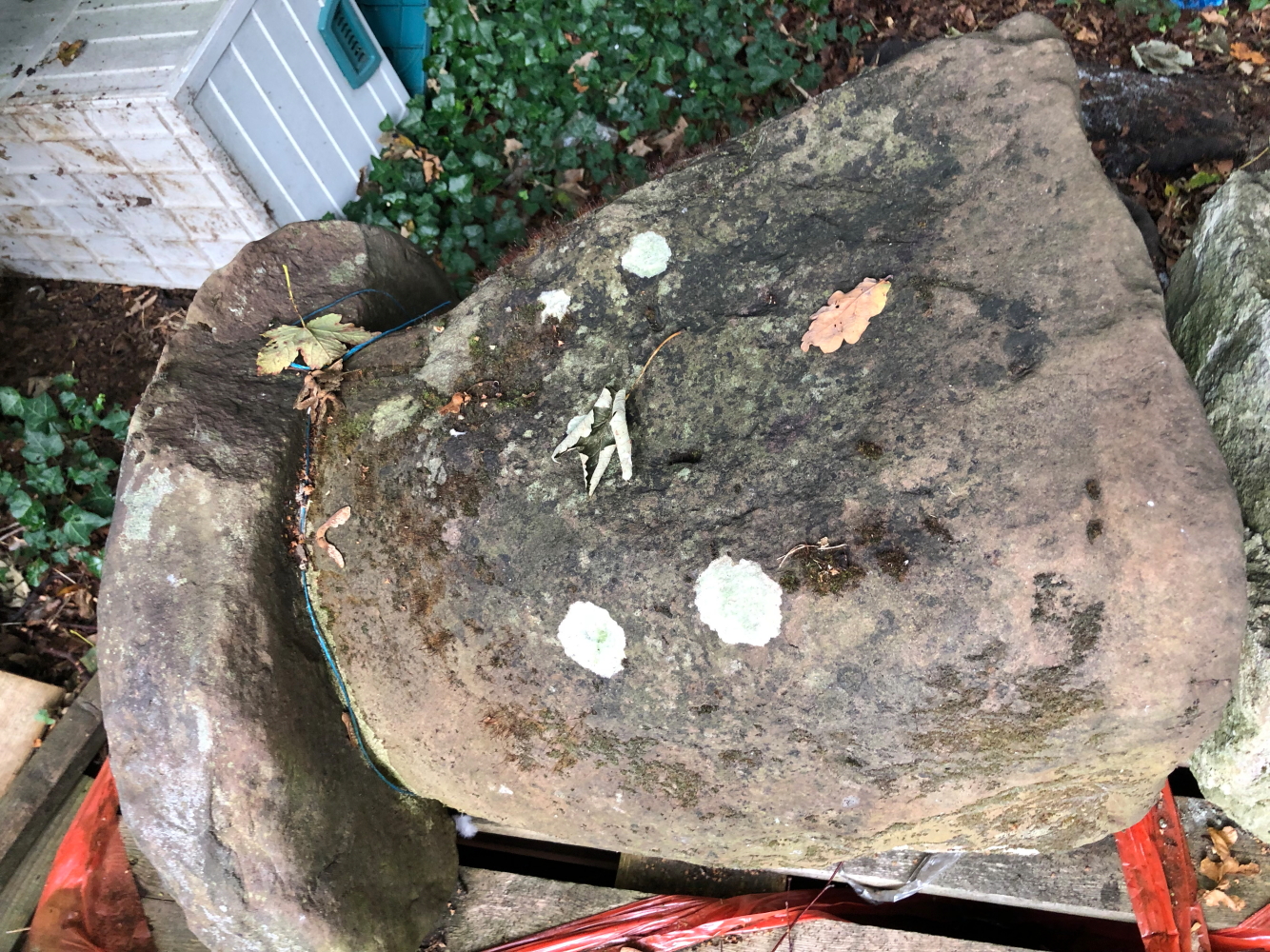 TWO VERY LARGE STADDLE STONES AND TOPS.