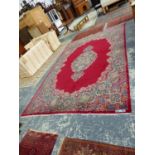 A PERSIAN KIRMAN CARPET, 453 x 295cms