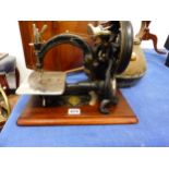 A WILLCOX AND GIBBS SEWING MACHINE WITH MAHOGANY TRANSIT CASE, A LARGE BRASS KETTLE, AND A COPPER