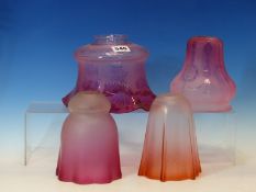 FOUR VARIOUS CRANBERRY TINTED GLASS SHADES, THREE ETCHED AND THE TALLEST FROSTED. H 16cms.