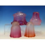 FOUR VARIOUS CRANBERRY TINTED GLASS SHADES, THREE ETCHED AND THE TALLEST FROSTED. H 16cms.