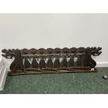 A CARVED WOOD PANEL PIERCED AND CARVED WITH EIGHT LADIES STANDING ON THE TAILS OF TWO DRAGONS, THEIR