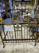 A BRASS DOUBLE BED, THE ENDS CENTRED BY RUSKIN TYPE TURQUOISE CERAMIC TREFOILS, ROUNDELS AT THE TOPS