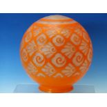 AN ART DECO ORANGE OVERLAY GLASS SPHERICAL SHADE, THE DIAMOND DIAPER CUTTING FILLED WITH STYLISED