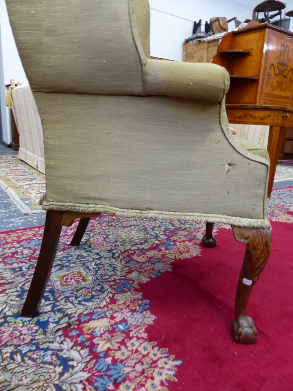 A 19th C. WING ARMCHAIR UPHOLSTERED IN OLIVE GREEN, THE CABRIOLE FRONT LEGS CARVED WITH LEAVES AT - Image 6 of 13