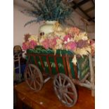 A VINTAGE HAND DRAWN CIDER VINEGAR CART FILLED WITH DRIED FLOWERS AND A DOULTON JAR INSCRIBED 1d A
