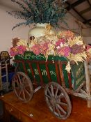 A VINTAGE HAND DRAWN CIDER VINEGAR CART FILLED WITH DRIED FLOWERS AND A DOULTON JAR INSCRIBED 1d A