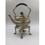 A VICTORIAN SILVER HALLMARKED TEAPOT AND TEA KETTLE STAND WITH BURNER. THE TEA KETTLE IS DATED
