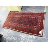 AN ANTIQUE BELOUCH RUG, 222 x 109cms