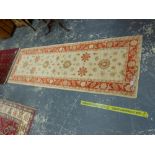 AN ORIENTAL RUG OF CAUCASIAN DESIGN, 194 x 120cms TOGETHER WITH AN ORIENTAL RUNNER OF PERSIAN