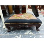 A VICTORIAN LOW FOOTSTOOL WITH NEEDLE POINT TOP AND A DEMI LUNE PAINTED TABLE.