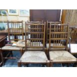 A SET OF FIVE RUSH SEAT SPINDLE BACK SIDE CHAIRS.