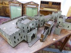 AN EARLY 20th C. ANGLO-INDIAN GREY COATED PLYWOOD MODEL FORT WITH CASTELLATED WALLS AND SIX TURRETS