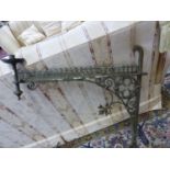 A PAIR OF ANTIQUE GOTHIC REVIVAL IRON CANDLESTICK BRACKETS, THE BAR BACK PLATES JOINED TO THE