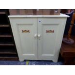 A VINTAGE PAINTED PINE TWO DOOR CABINET.