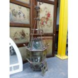 TWO ARTS AND CRAFTS WROUGHT IRON AND LEADED GLASS HALL LANTERNS / LIGHTS FLARING FROM THE TOPS TO