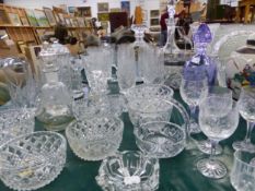 A QUANTITY OF VARIOUS GLASSWARE'S INCLUDING DECANTERS, VASES, BOWLS, AND A POTTERY ORIENTAL GINGER