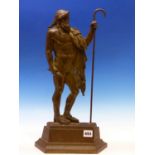 A BRONZE DOORSTOP CAST AS A CLASSICAL MAN STANDING WITH A SHEPHERDS CROOK IN HIS LEFT HAND. H