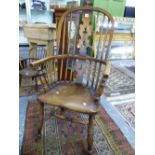 AN ANTIQUE OAK AND ELM WINDSOR CHAIR, THE CENTRAL BACK SPLAT PIERCED WITH THREE TREFOILS ABOVE A SAD