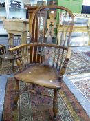 AN ANTIQUE OAK AND ELM WINDSOR CHAIR, THE CENTRAL BACK SPLAT PIERCED WITH THREE TREFOILS ABOVE A SAD