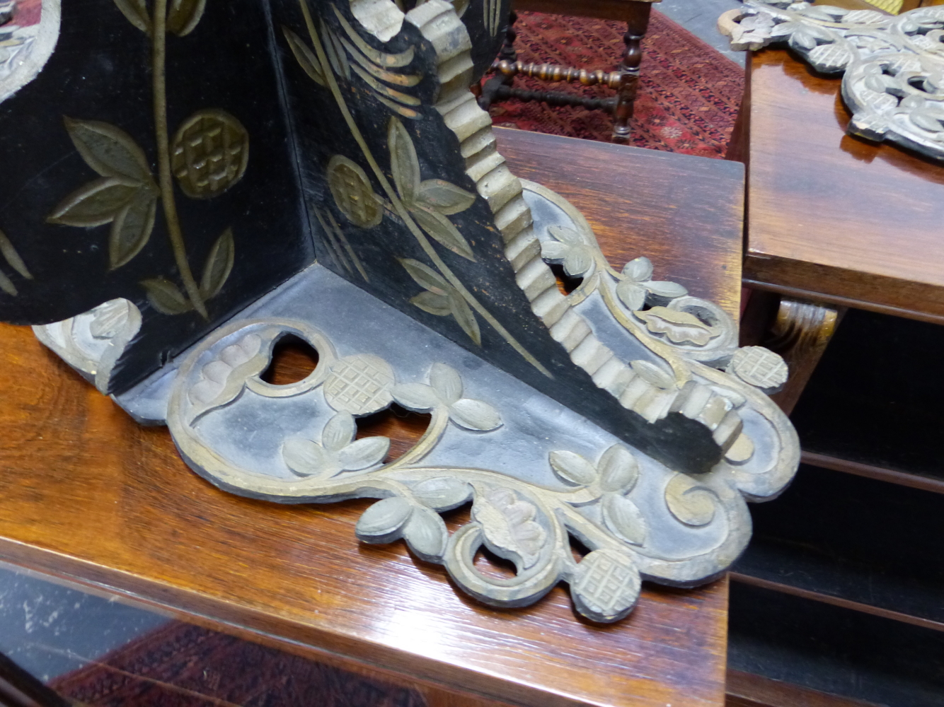 A PAIR OF TURKISH TURBAN STANDS CARVED AND PAINTED WITH FLOWERS ON A BLACK GROUND AROUND MINARETS. H - Image 3 of 5