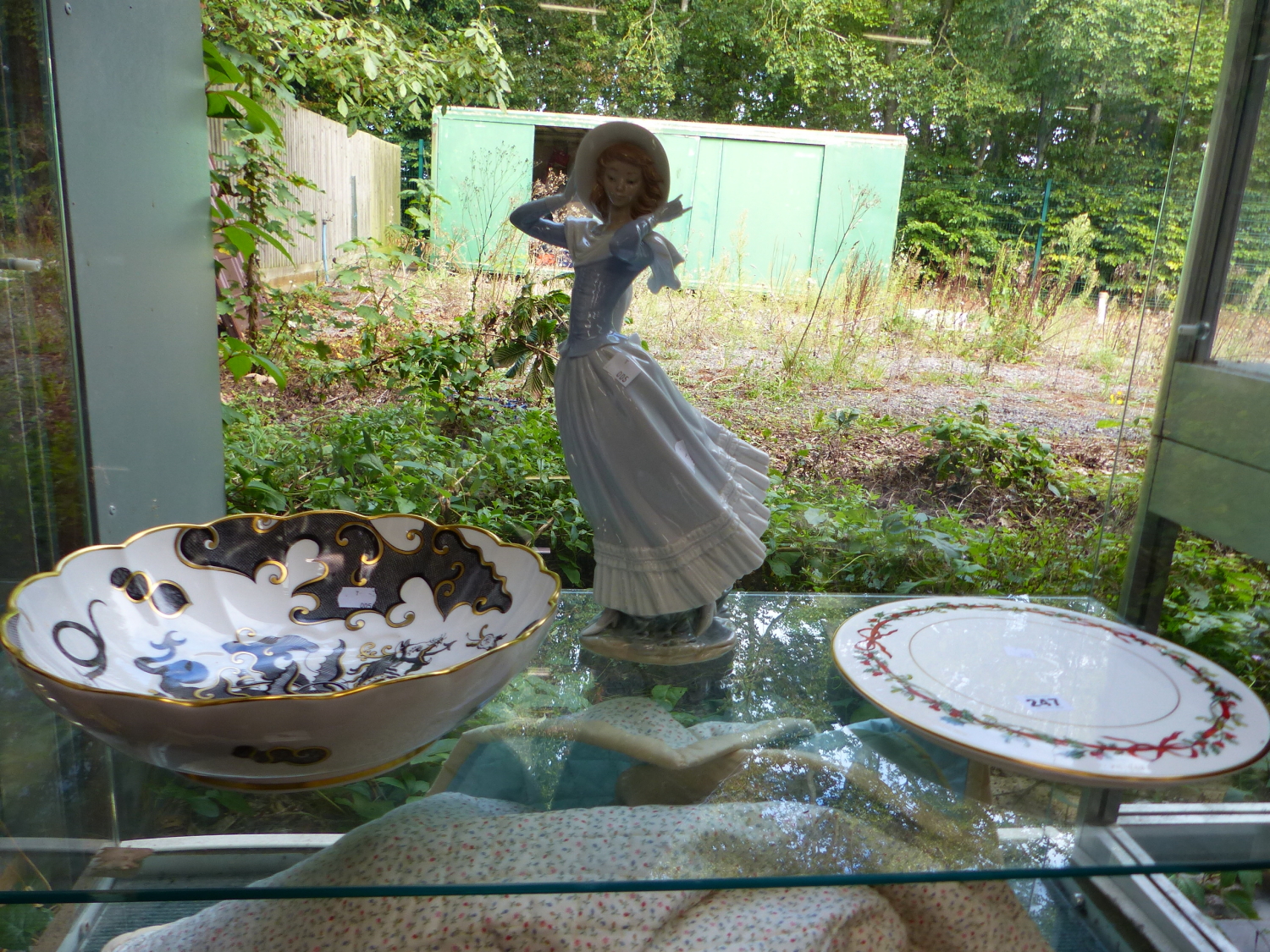 A ROYAL WORCESTER NUMBER 204 BLACK AND GILDED MYTHICAL BOWL, TOGETHER WITH A LLADRO FIGURINE AND