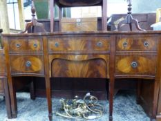 A GEORGIAN STYLE MAHOGANY SERPENTINE FRONT SIDE BOARD.