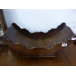A 19th C. MAHOGANY CHEESE CRADLE, THE BOAT SHAPE ON FOUR CASTER FEET. W 46.5cms. TOGETHER WITH TWO