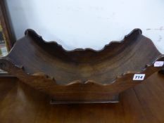 A 19th C. MAHOGANY CHEESE CRADLE, THE BOAT SHAPE ON FOUR CASTER FEET. W 46.5cms. TOGETHER WITH TWO