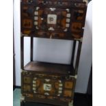 A KOREAN HARDWOOD CABINET WITH A CENTRAL SHELF BETWEEN CUPBOARDS EACH TOPPED BY THREE DRAWERS AND