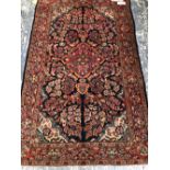 A PERSIAN SAROUK RUG, 203 x 125cms