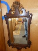 A PAINTED FAUX BOIS CUT WORK MIRROR WITH GILT CRESTING OF A BASKET OF FLOWERS. 80 x 42cms.