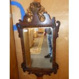 A PAINTED FAUX BOIS CUT WORK MIRROR WITH GILT CRESTING OF A BASKET OF FLOWERS. 80 x 42cms.