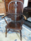 AN ANTIQUE WINDSOR CHAIR WITH TRIPLE PIERCED SPLAT FLANKED BY THREE STICKS, THE SADDLE SEAT ABOVE TU