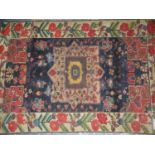 AN ANTIQUE PERSIAN BAKTHIARI RUG, 176 x 119cms