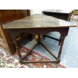 A GEORGE III OAK CRICKET TABLE, THE TRIPLE PLANK TRUNCATED TRIANGULAR TOP ABOVE A WAVY APRON, THE