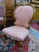 A 19th C.MAHOGANY SHOW FRAME NURSING CHAIR, THE HOOP BACK WITH CHEVRON WINGS ABOVE THE SEAT, THE