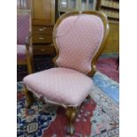 A 19th C.MAHOGANY SHOW FRAME NURSING CHAIR, THE HOOP BACK WITH CHEVRON WINGS ABOVE THE SEAT, THE